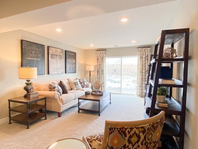 living room featuring baseboards, carpet floors, and recessed lighting