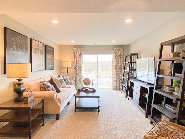 living area with carpet floors and recessed lighting