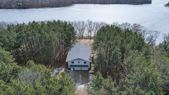 drone / aerial view featuring a view of trees and a water view