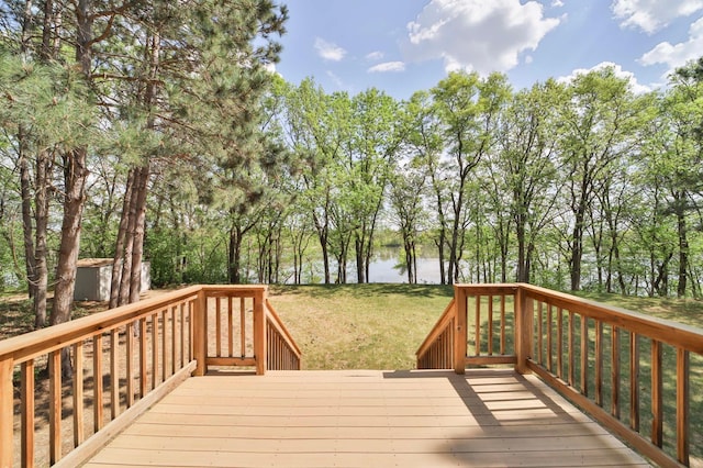 1505 Harrison Dr SW, Brainerd, MN 56401 - wooden terrace featuring a water view, a lawn, and view of scattered trees