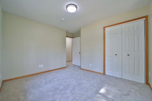 1505 Harrison Dr SW, Brainerd, MN 56401 - unfurnished bedroom with carpet, a closet, baseboards, and a textured ceiling