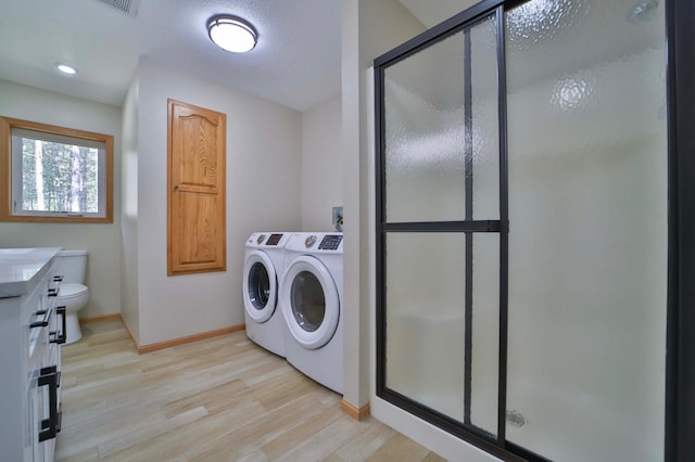 1505 Harrison Dr SW, Brainerd, MN 56401 - washroom with separate washer and dryer, baseboards, and light wood-style flooring