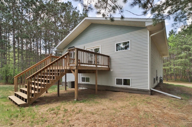 1505 Harrison Dr SW, Brainerd, MN 56401 - rear view of house with a wooden deck, stairway, and central AC unit