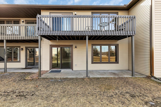 rear view of house with a patio area and a deck