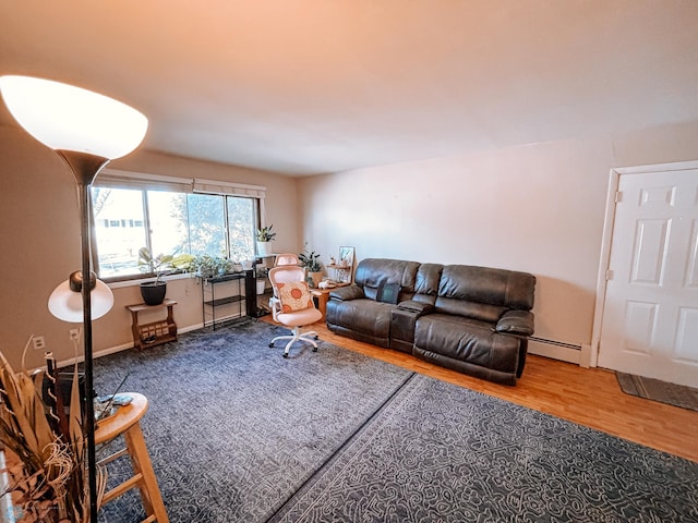 living area with a baseboard radiator and wood finished floors