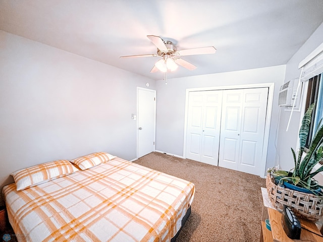 bedroom featuring ceiling fan, a closet, carpet flooring, and a wall mounted air conditioner