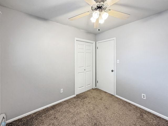 2815 9th St N Unit B4, Fargo, ND 58102 - empty room with carpet floors, a baseboard radiator, baseboards, and ceiling fan