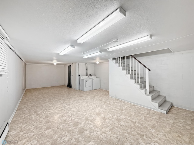 2815 9th St N Unit B4, Fargo, ND 58102 - finished below grade area featuring washing machine and clothes dryer, a baseboard heating unit, stairway, a textured ceiling, and tile patterned floors