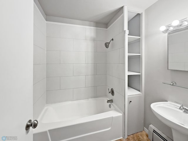 2815 9th St N Unit B4, Fargo, ND 58102 - full bathroom with baseboard heating,  shower combination, and a sink