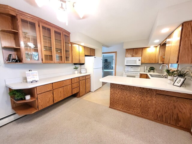 13857 Jacob Ave, Nininger Twp, MN 55033 - kitchen featuring white appliances, brown cabinetry, open shelves, light countertops, and a peninsula