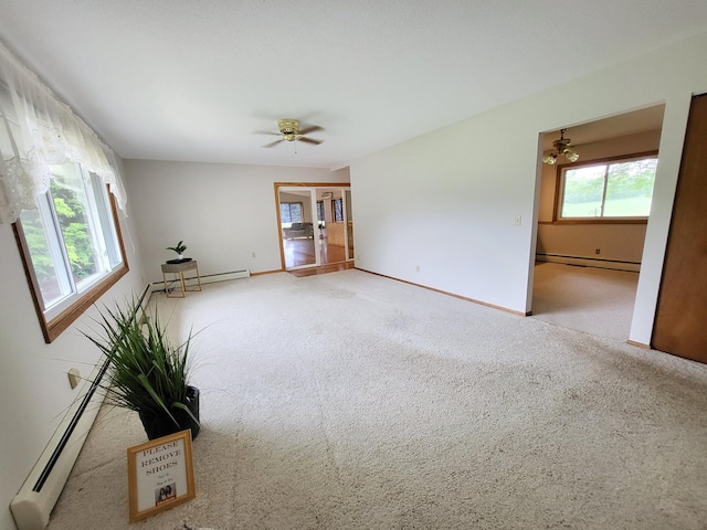 13857 Jacob Ave, Nininger Twp, MN 55033 - unfurnished living room with baseboard heating, carpet floors, and a baseboard radiator