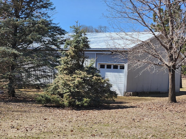 13857 Jacob Ave, Nininger Twp, MN 55033 - view of side of property with a metal roof and a garage