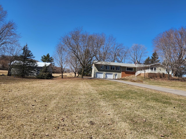 13857 Jacob Ave, Nininger Twp, MN 55033 - view of front of house featuring a garage, a front lawn, and driveway