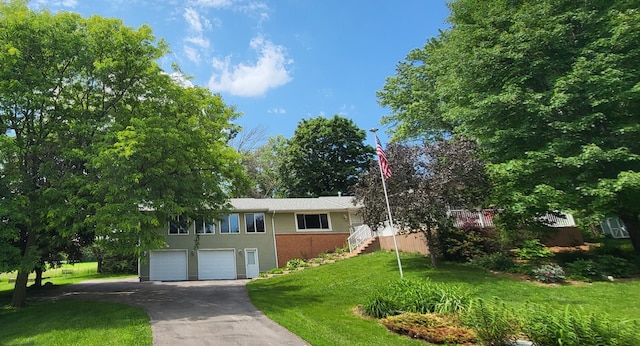 13857 Jacob Ave, Nininger Twp, MN 55033 - single story home with asphalt driveway, stairs, an attached garage, and a front yard