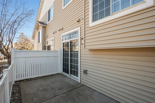 view of patio / terrace featuring fence