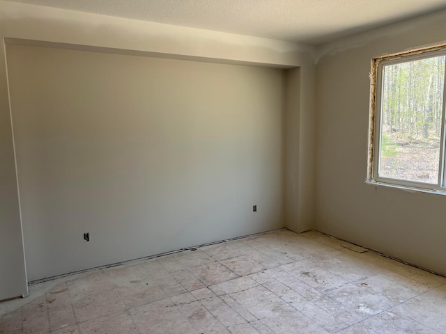 unfurnished room with plenty of natural light