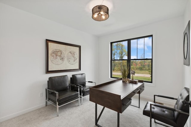 carpeted home office with baseboards