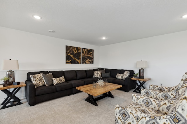 living area with light carpet and recessed lighting