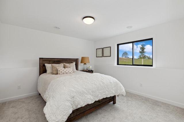 bedroom with carpet and baseboards