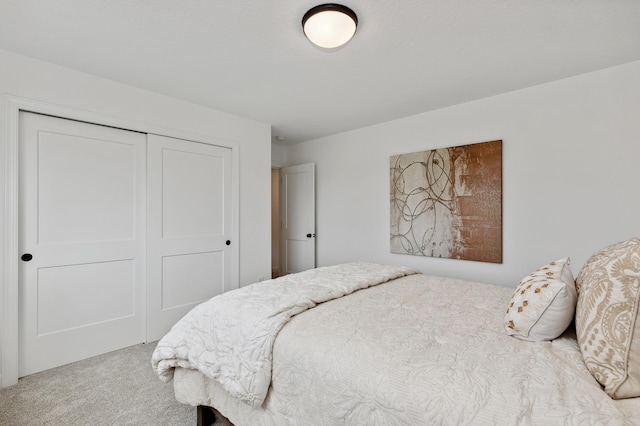 bedroom with carpet and a closet