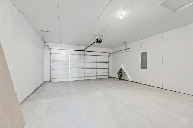 garage with electric panel and a garage door opener