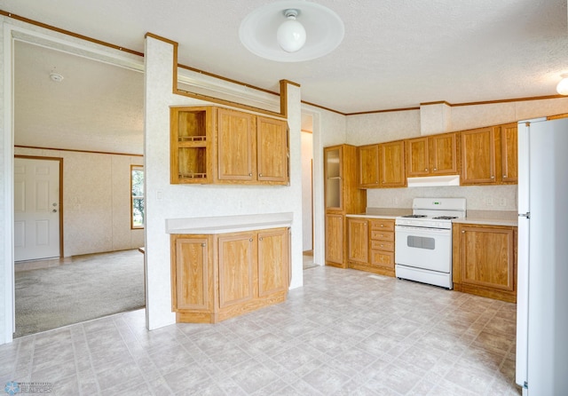 kitchen with light floors, light countertops, ornamental molding, white appliances, and under cabinet range hood