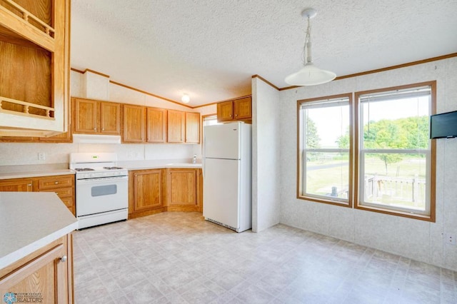 kitchen featuring white appliances, vaulted ceiling, light countertops, and light floors