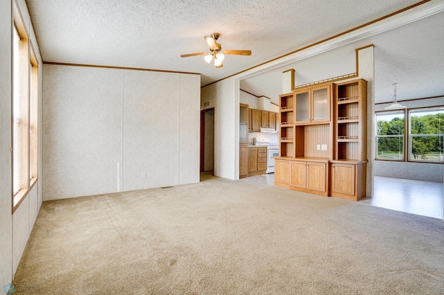 unfurnished living room with a ceiling fan, light colored carpet, vaulted ceiling, and a textured ceiling