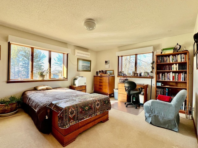 carpeted bedroom featuring a textured ceiling and a wall mounted air conditioner