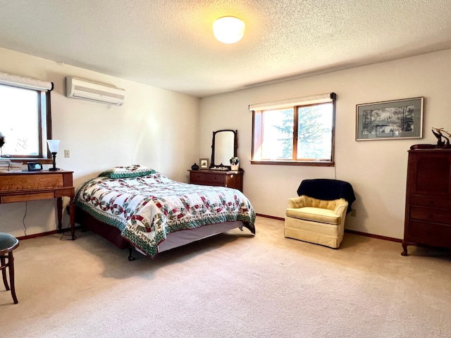 carpeted bedroom with an AC wall unit, multiple windows, and baseboards