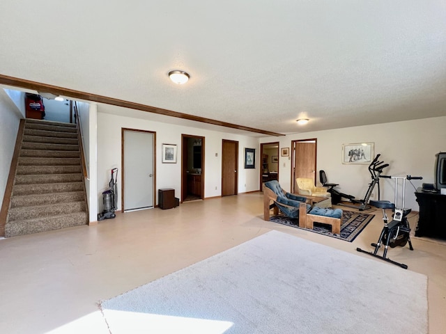 exercise room featuring a textured ceiling