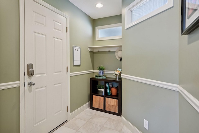 entryway featuring tile patterned floors and baseboards