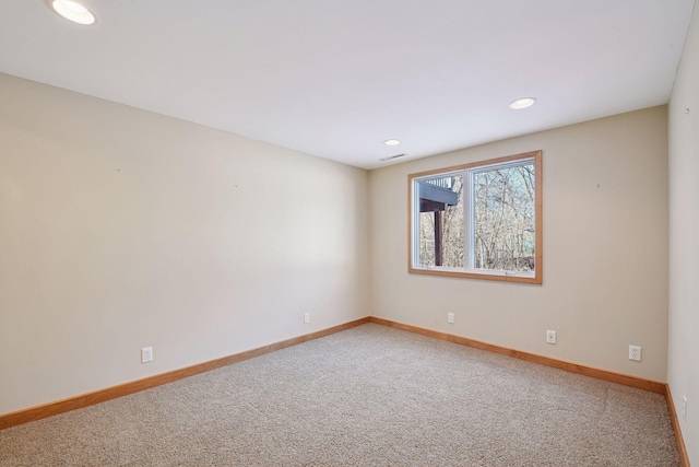 empty room with recessed lighting, baseboards, and carpet