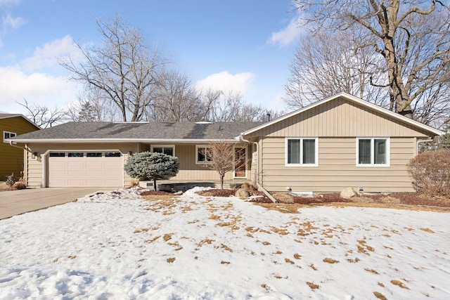 ranch-style house with driveway and an attached garage