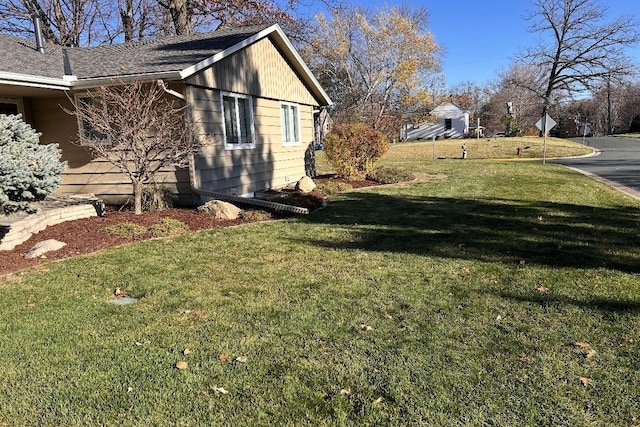 view of property exterior featuring a lawn