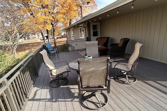 deck with outdoor dining space