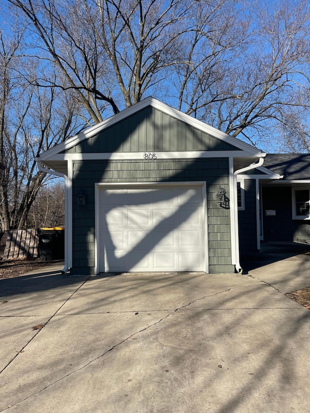 garage with concrete driveway