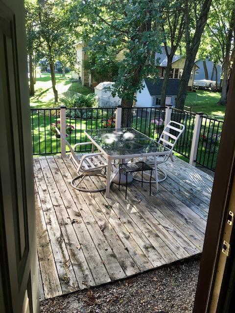 wooden terrace with outdoor dining area