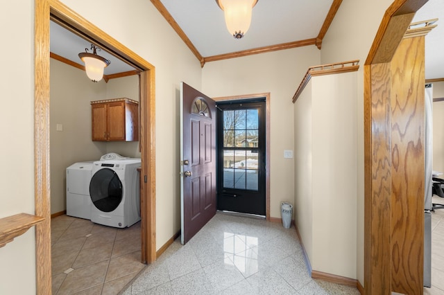 foyer featuring washer and dryer, granite finish floor, baseboards, and ornamental molding