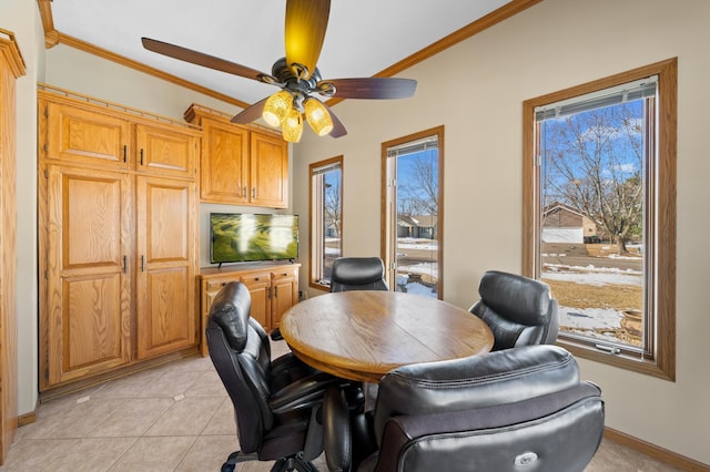 office space with light tile patterned floors, a ceiling fan, crown molding, and baseboards