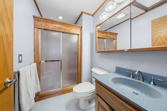 full bath featuring a shower stall, toilet, ornamental molding, tile patterned floors, and vanity