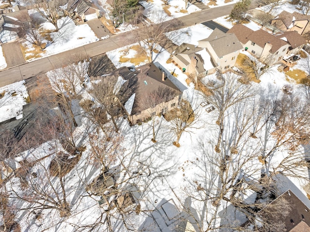 snowy aerial view featuring a residential view