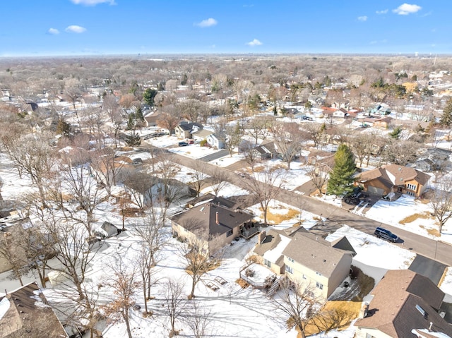 snowy aerial view featuring a residential view