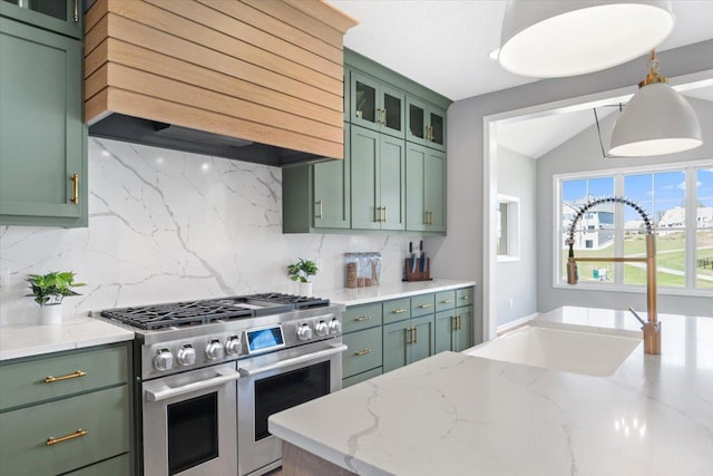 kitchen featuring range with two ovens, custom exhaust hood, and green cabinetry