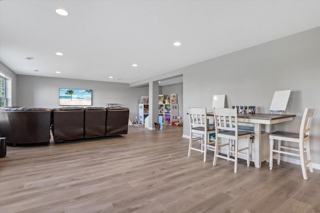 dining room featuring recessed lighting, baseboards, and wood finished floors