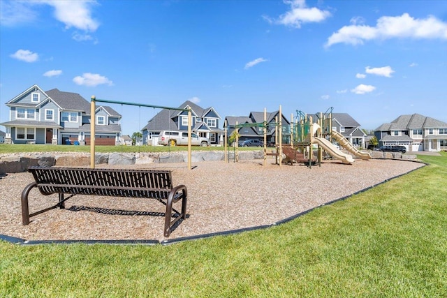 community jungle gym featuring a yard and a residential view