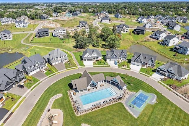 bird's eye view with a water view and a residential view