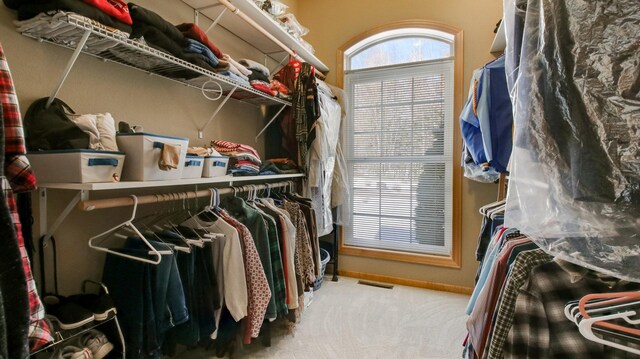 spacious closet featuring carpet and visible vents