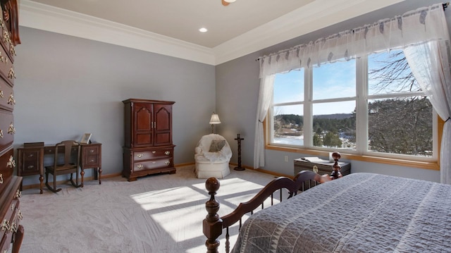 bedroom featuring baseboards, crown molding, and light colored carpet