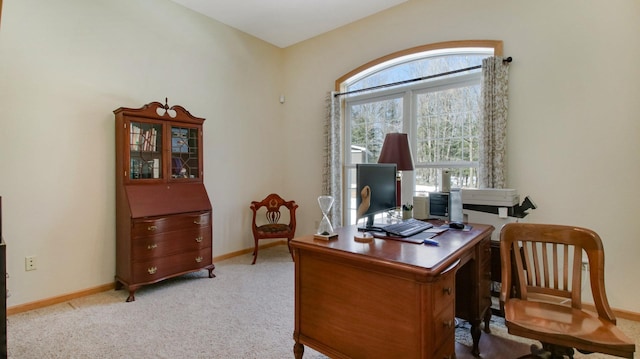 home office featuring light carpet and baseboards